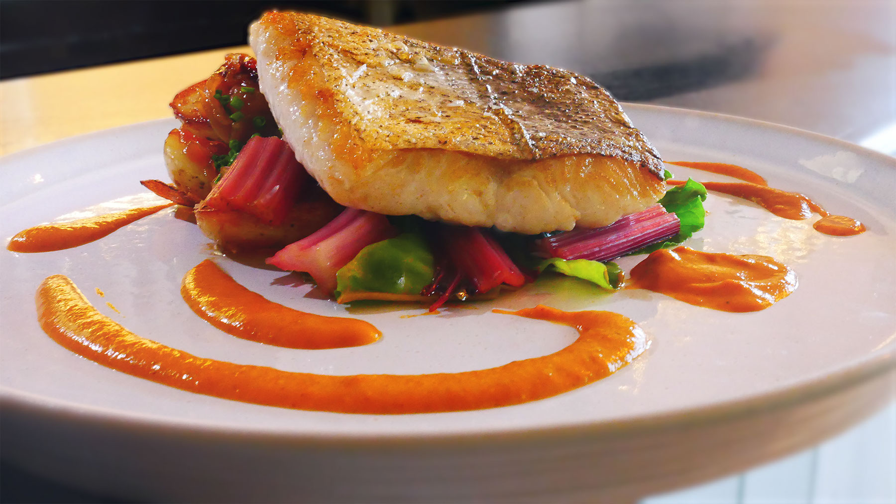 Pan-roasted fish with rhubarb and seasonal greens